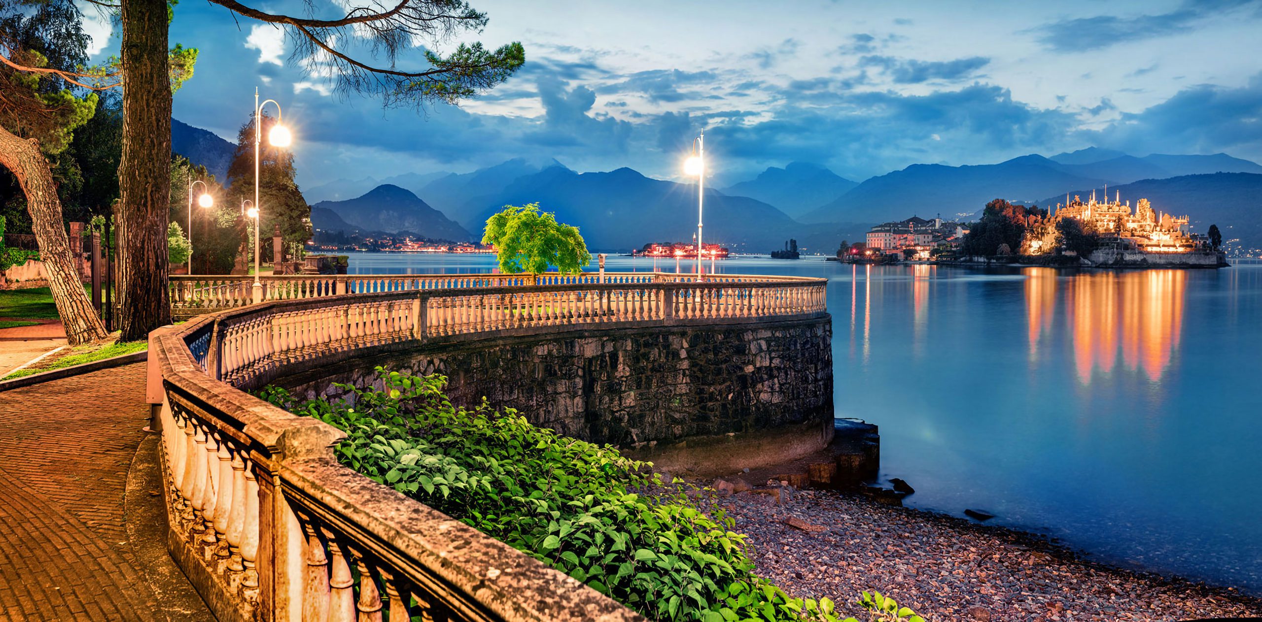 Great evening cityscape of Stresa town. Picturesque summer susns